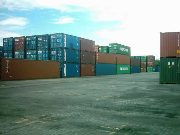 Open container yard with stacked shipping containers